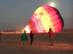 The hot air balloon getting filled in the desert outside Dubai.